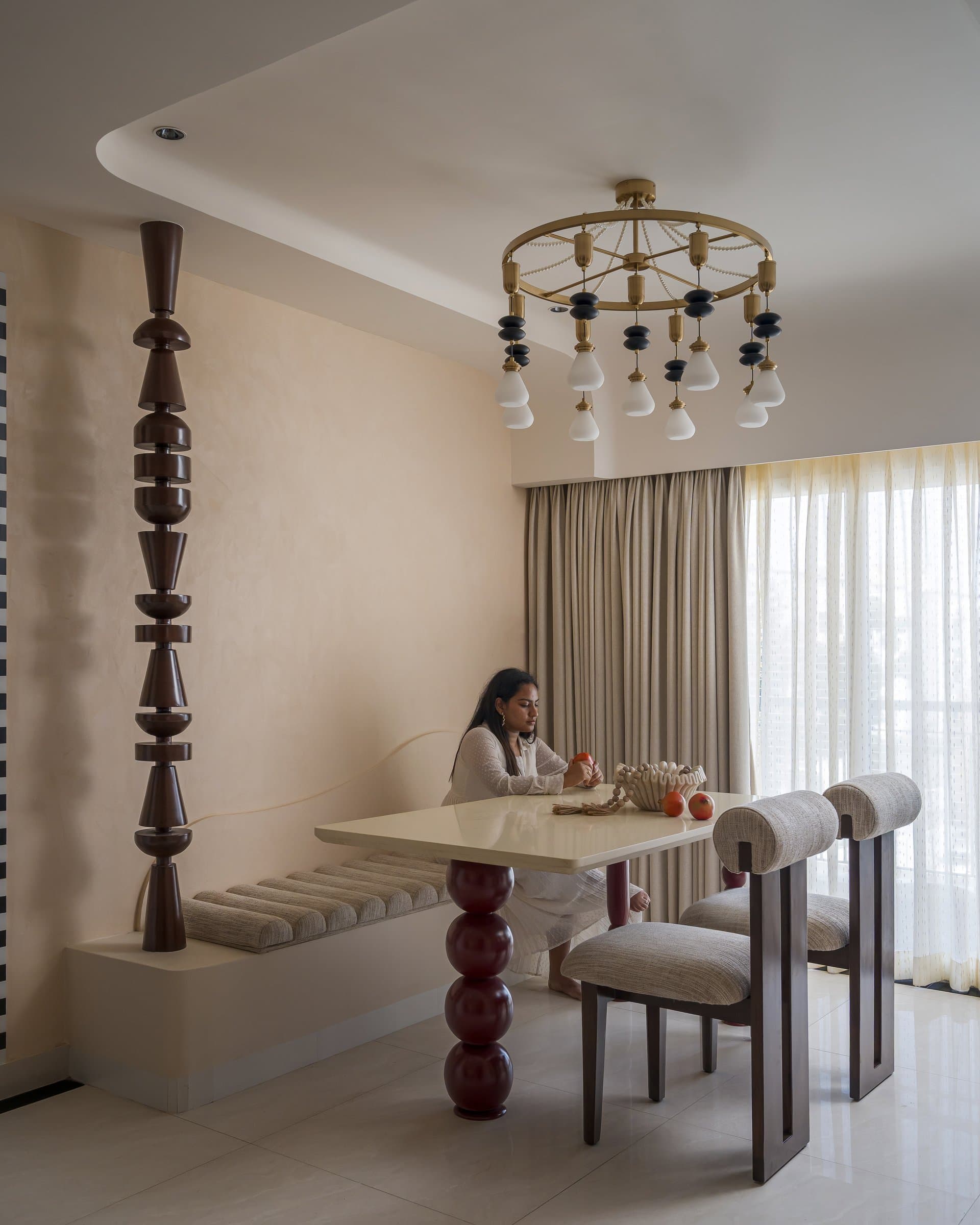 The dining zone in use, where filtered light and a generous banquette encourage an unhurried pace