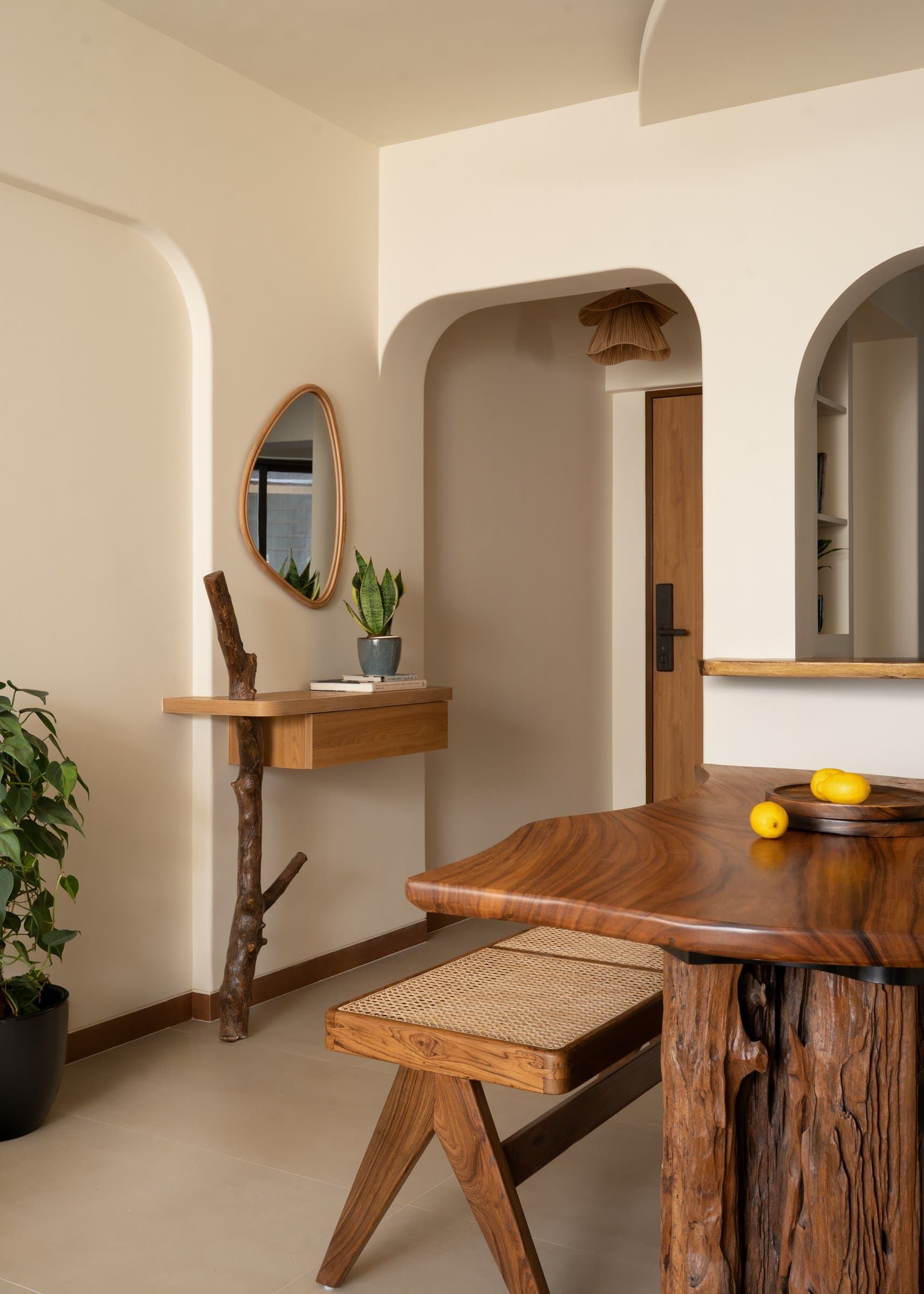 The foyer vignette, where a real branch holds up a floating timber console