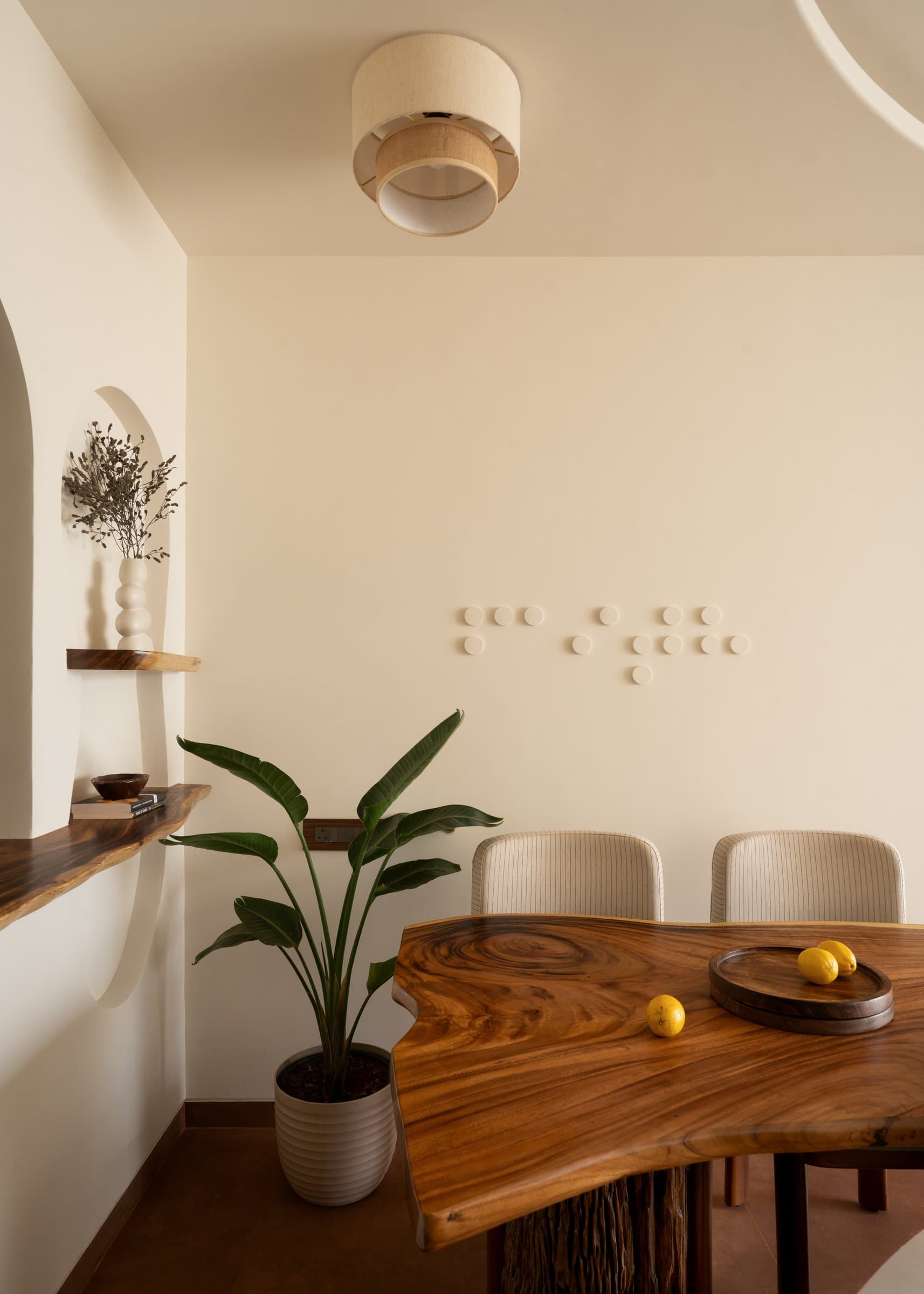 Ceramic discs arranged in the cadence of braille, the dining area's one piece of overt wall art