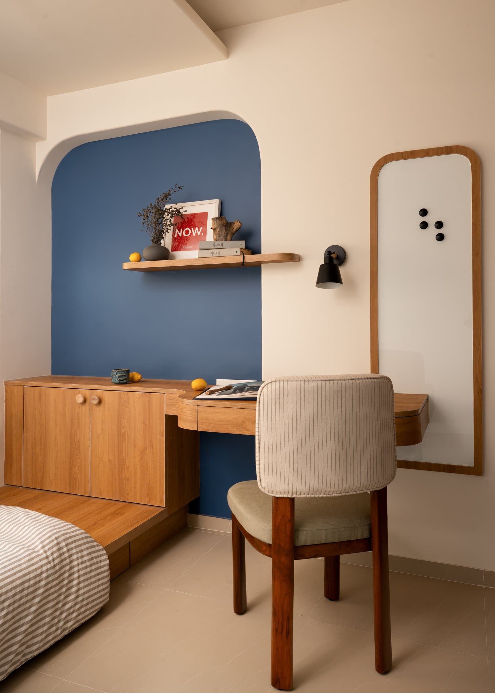 A cobalt-painted study niche, the room's single piece of chromatic drama