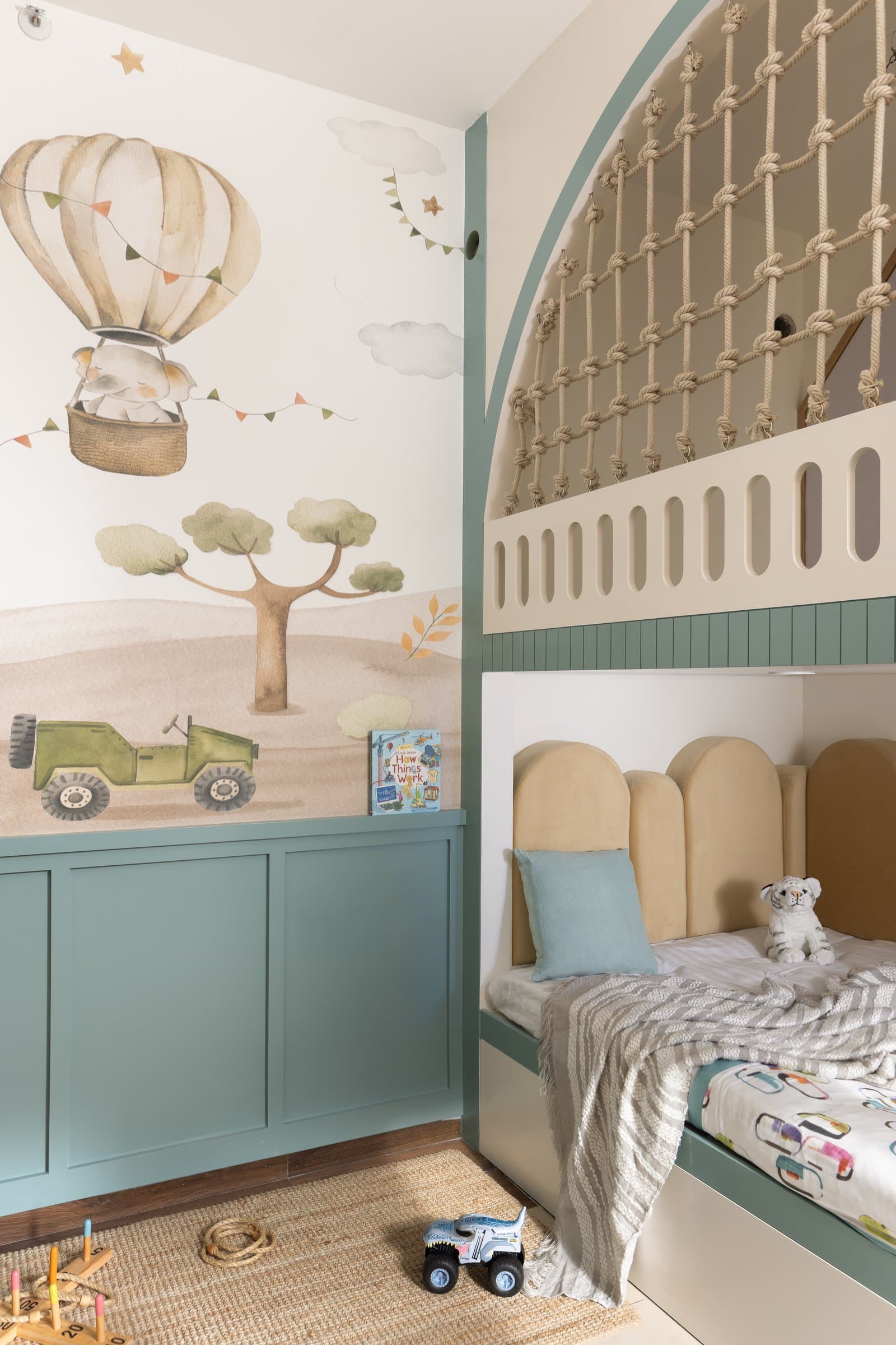 The children's room, where a watercolour mural and a built-in bunk bed read as small architecture rather than furniture