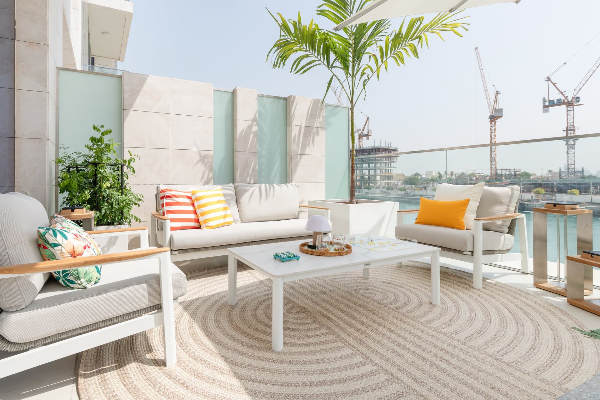 Striped cushions on the terrace lounge, the one place in the home where colour behaves loosely