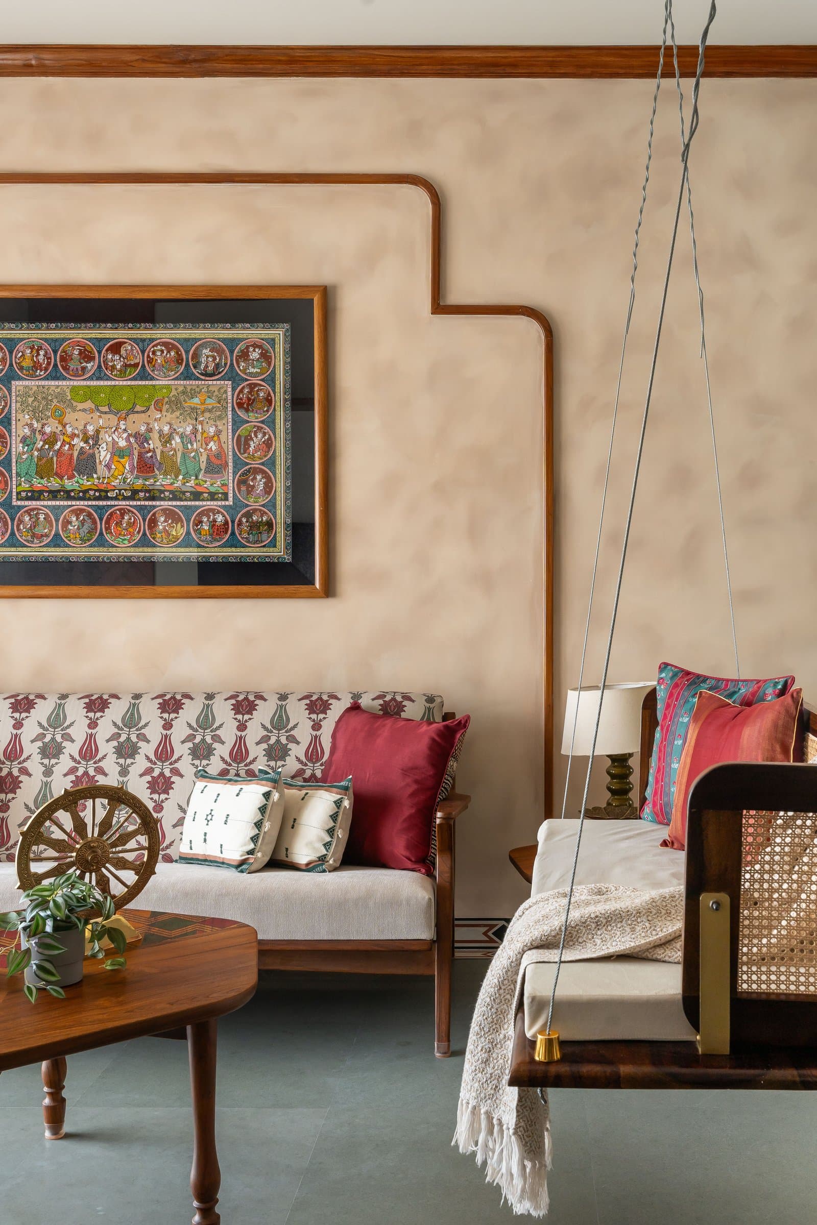 Closer in: a tulip block-printed settee meets the Pattachitra's vignettes against a limewashed wall