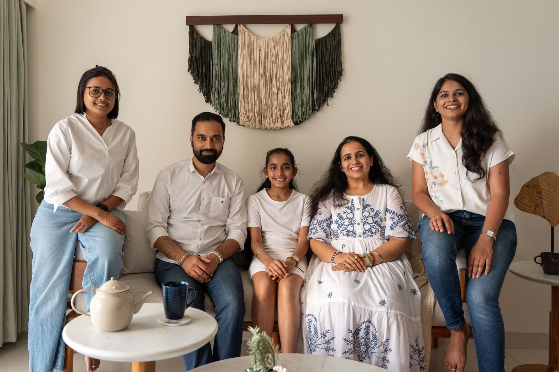 The family with the design team of Simplyfyspaces, photographed in the living room they now call home