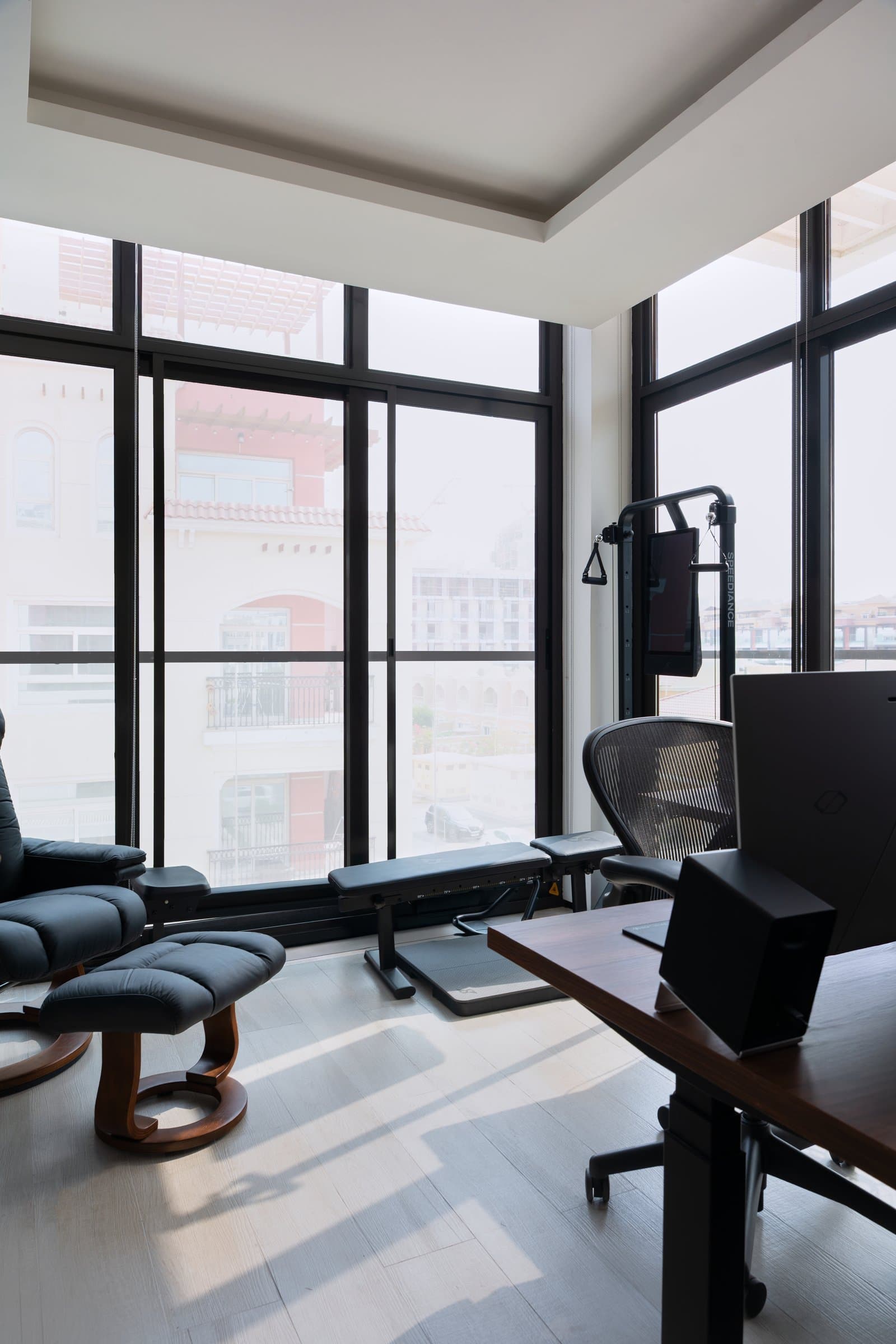 The corner home office and gym, where two walls of glazing allow three functions to share one room without compromise