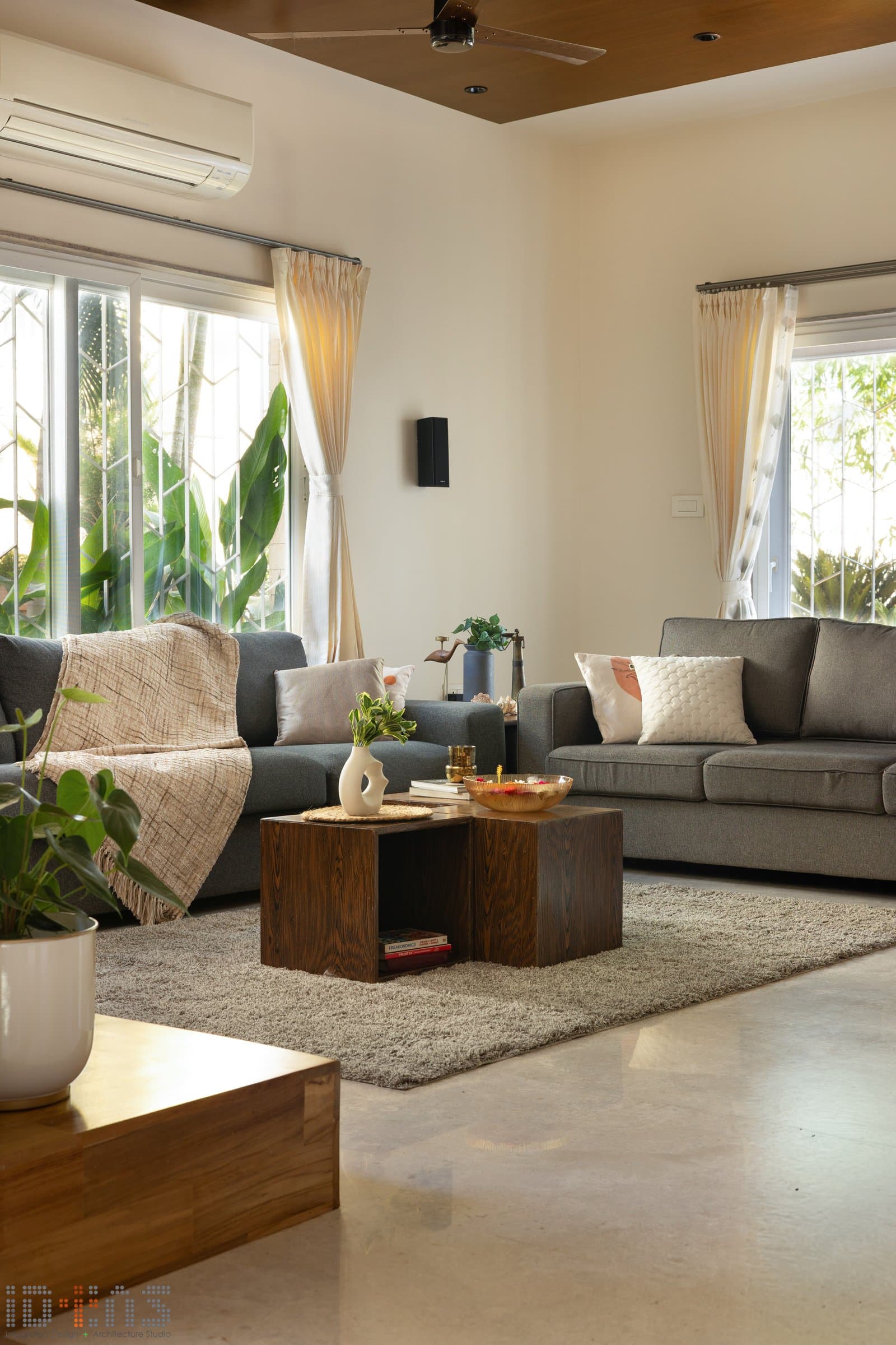 The seating arrangement, restrained to the point of austerity, lets filtered light do the decorative work