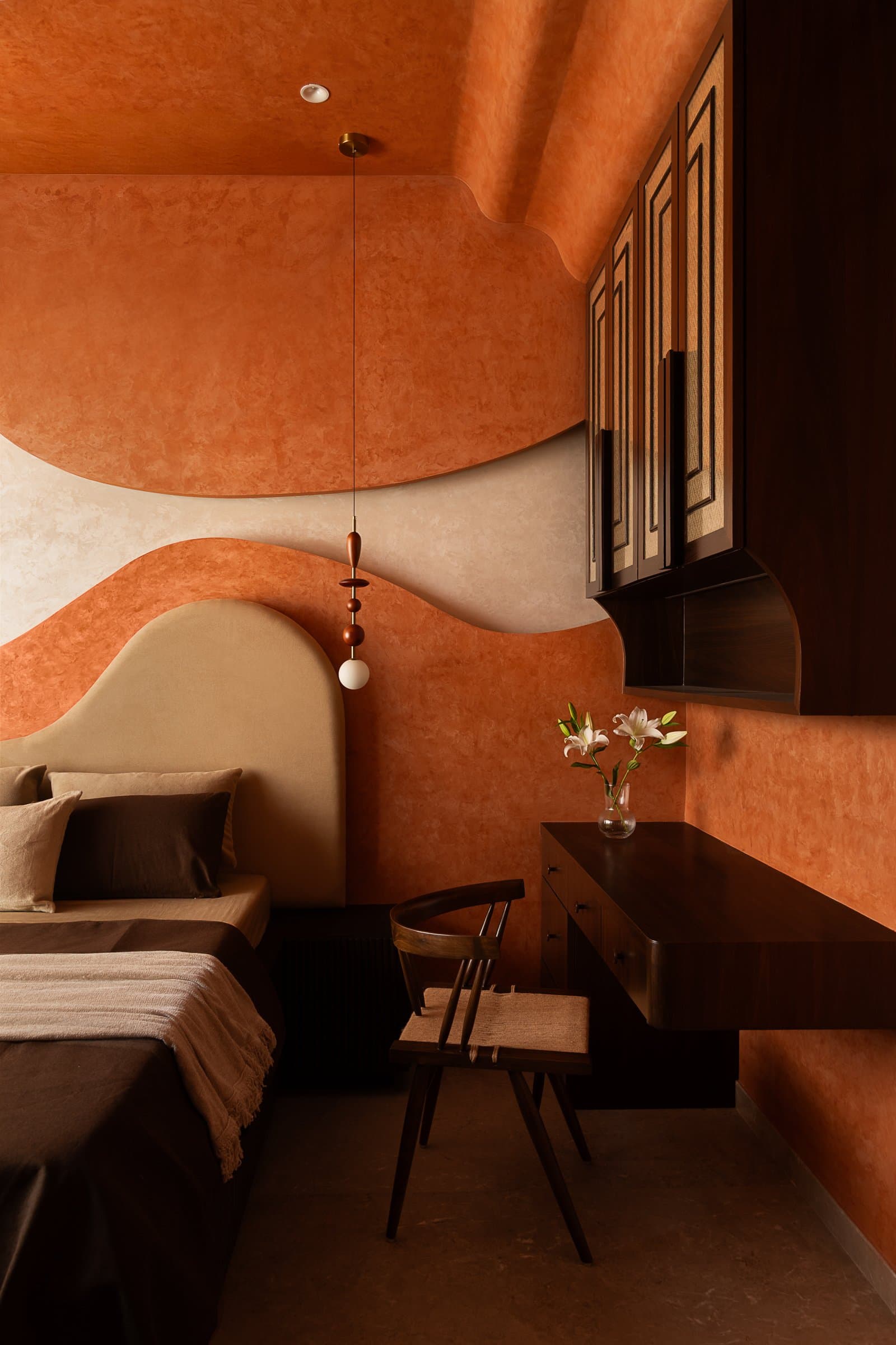 An interior moment from Studio Homzstead, where warm materials, textured surfaces, and ambient lighting build atmosphere rather than spectacle