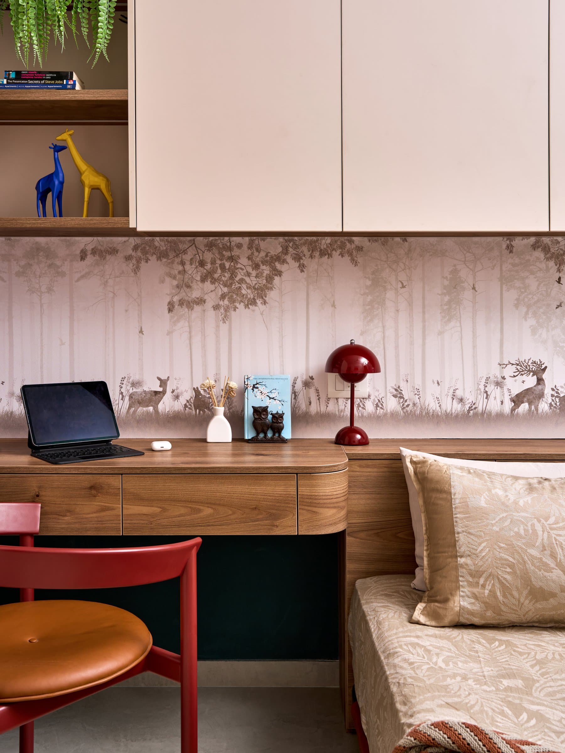 The integrated study console, a continuous wood surface that absorbs desk, headboard, and storage into one piece