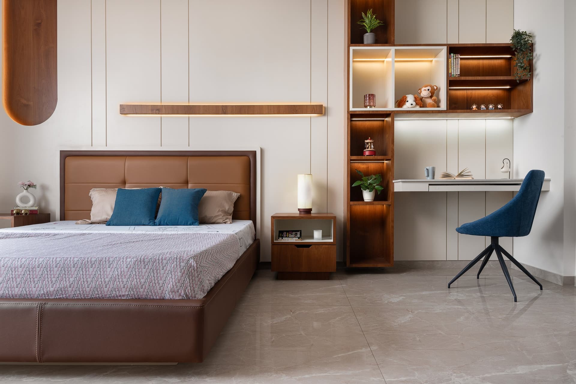 The children's bedroom: a tan leather bed, vertical reeding, and the home's most expressive piece of joinery