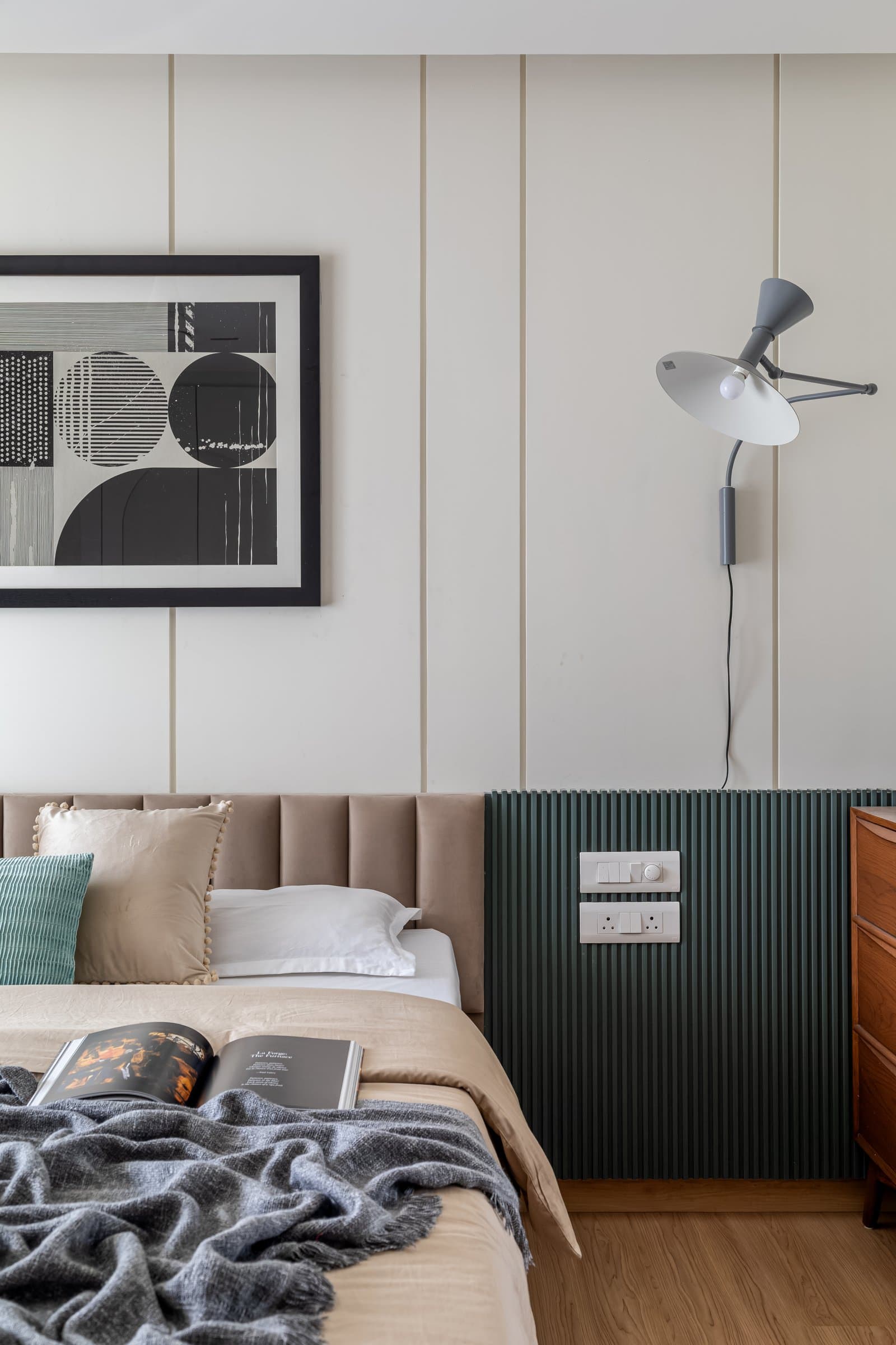 A closer view of the headboard wall, where the brass reveals catch light only on inspection