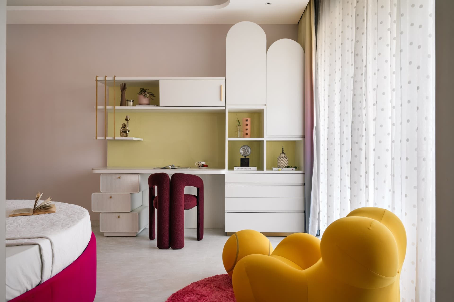 Ombré curtains and a sculptural yellow lounge chair give the daughter's room its sense of fantasy without tipping into theme