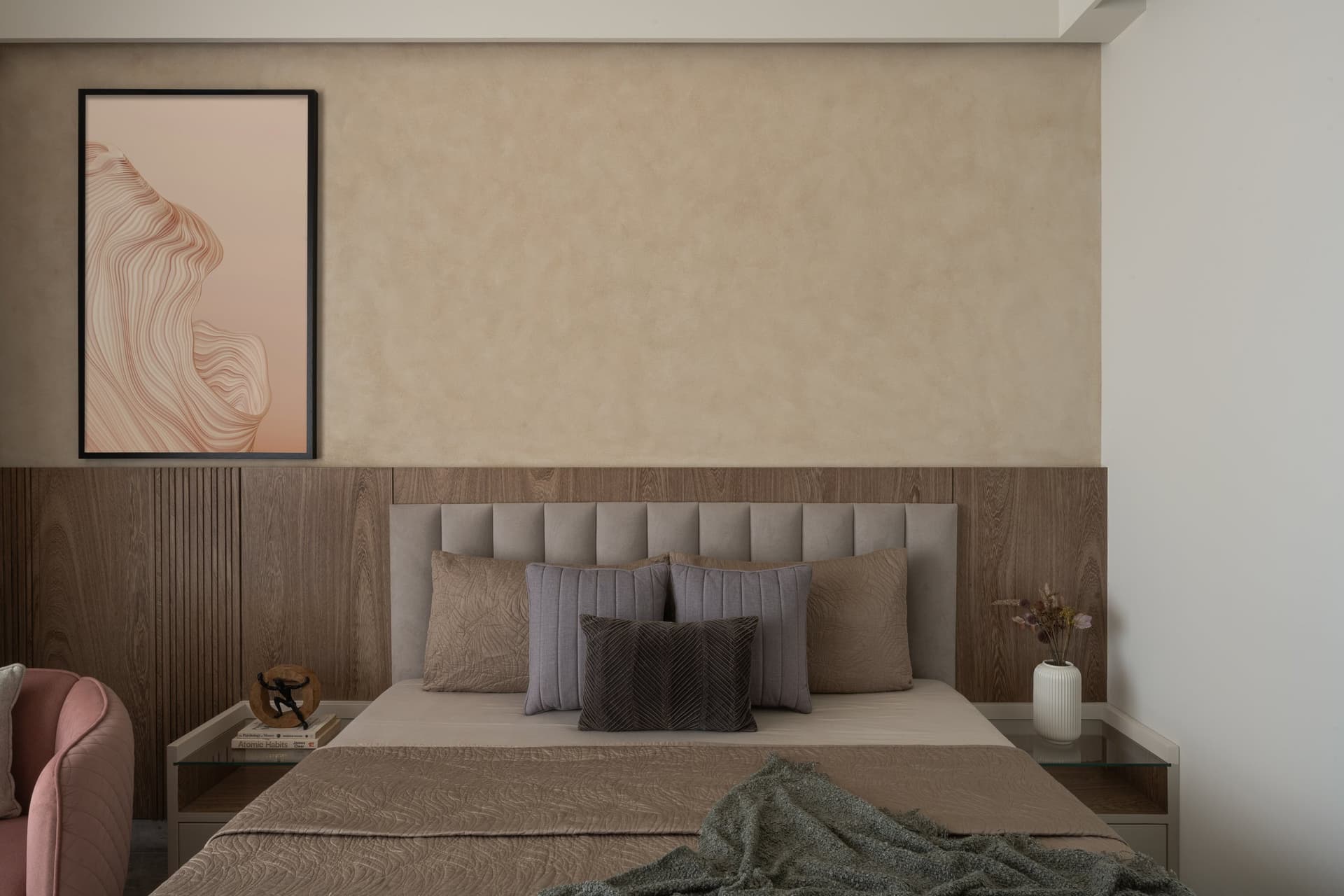 The second bedroom, recalibrated to a softer register of textured plaster and pale coral