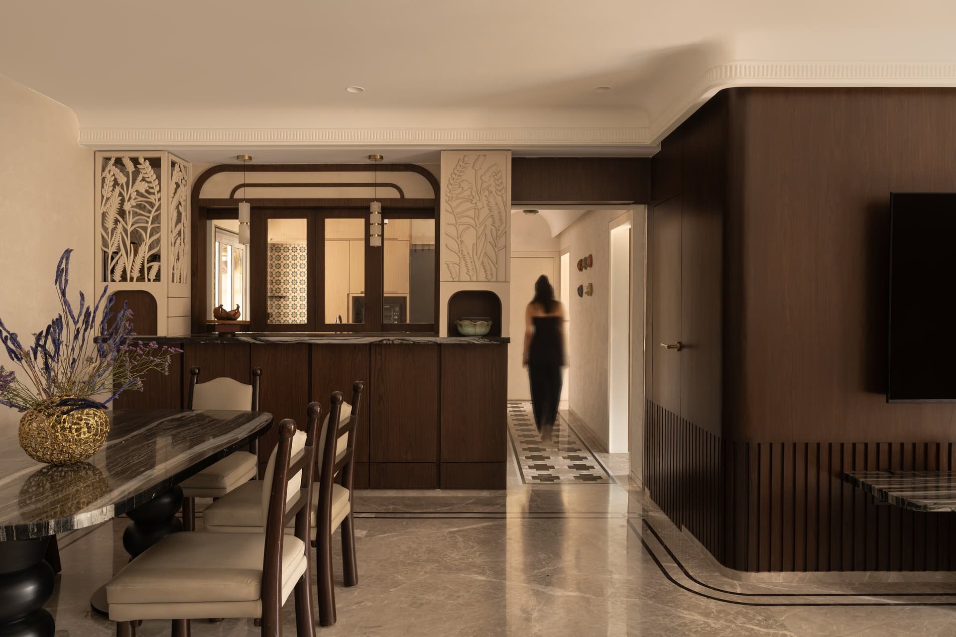 The dining table on its turned black pedestals, a recurring formal motif in the apartment's furniture vocabulary