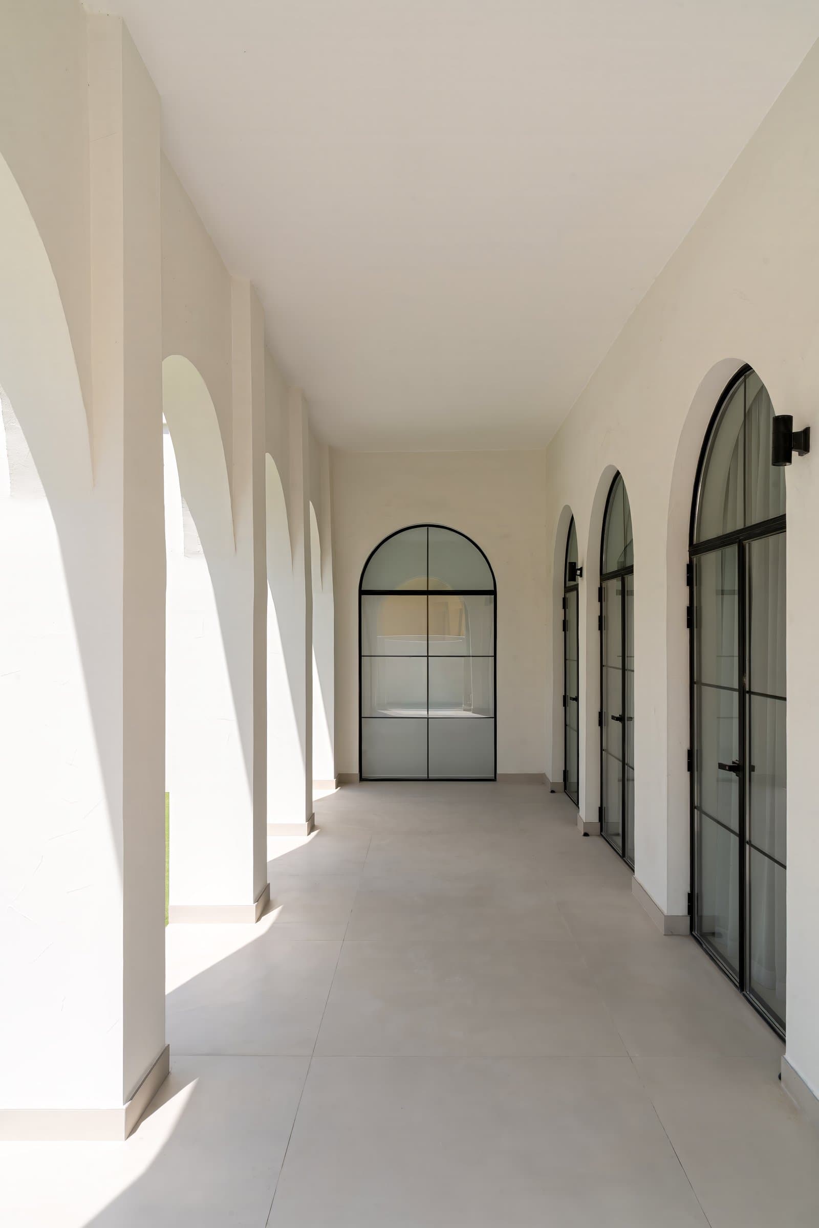The upper-level loggia, where the arched openings of the façade reveal their full architectural clarity