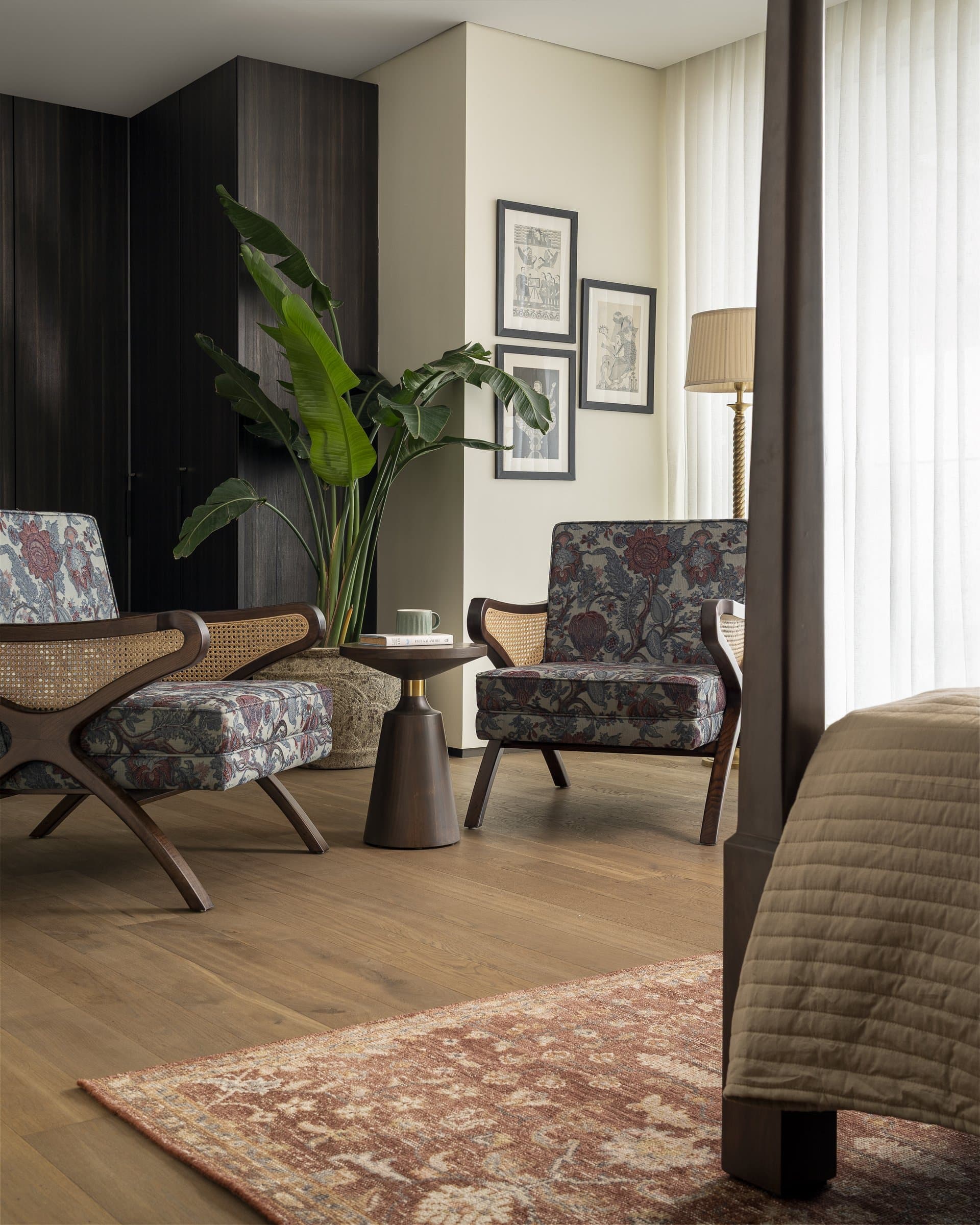 A seating corner within the master bedroom, given enough room to be used rather than only looked at