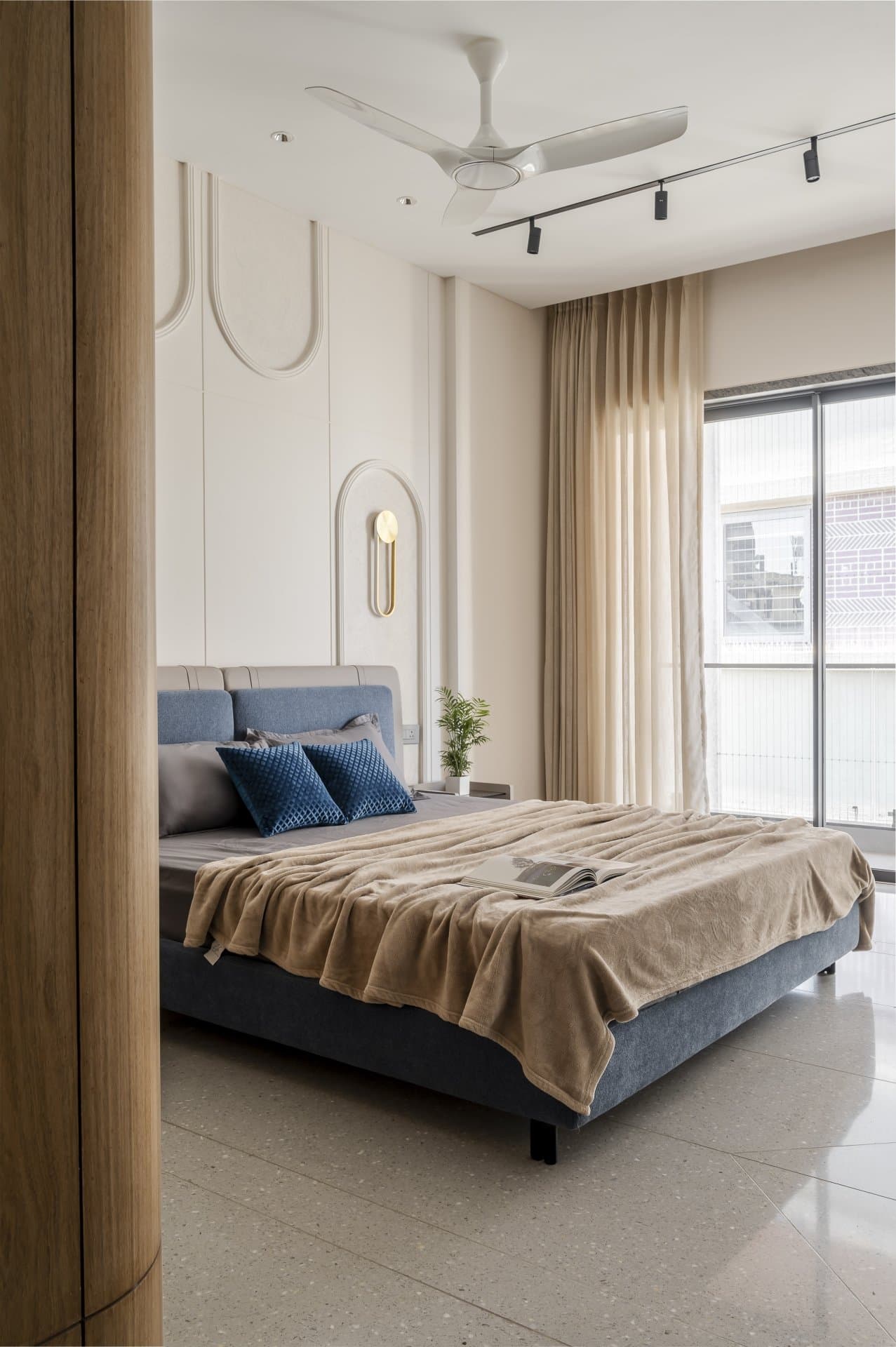The daughter's bedroom, where blush panel mouldings introduce a soft ornamental rhythm