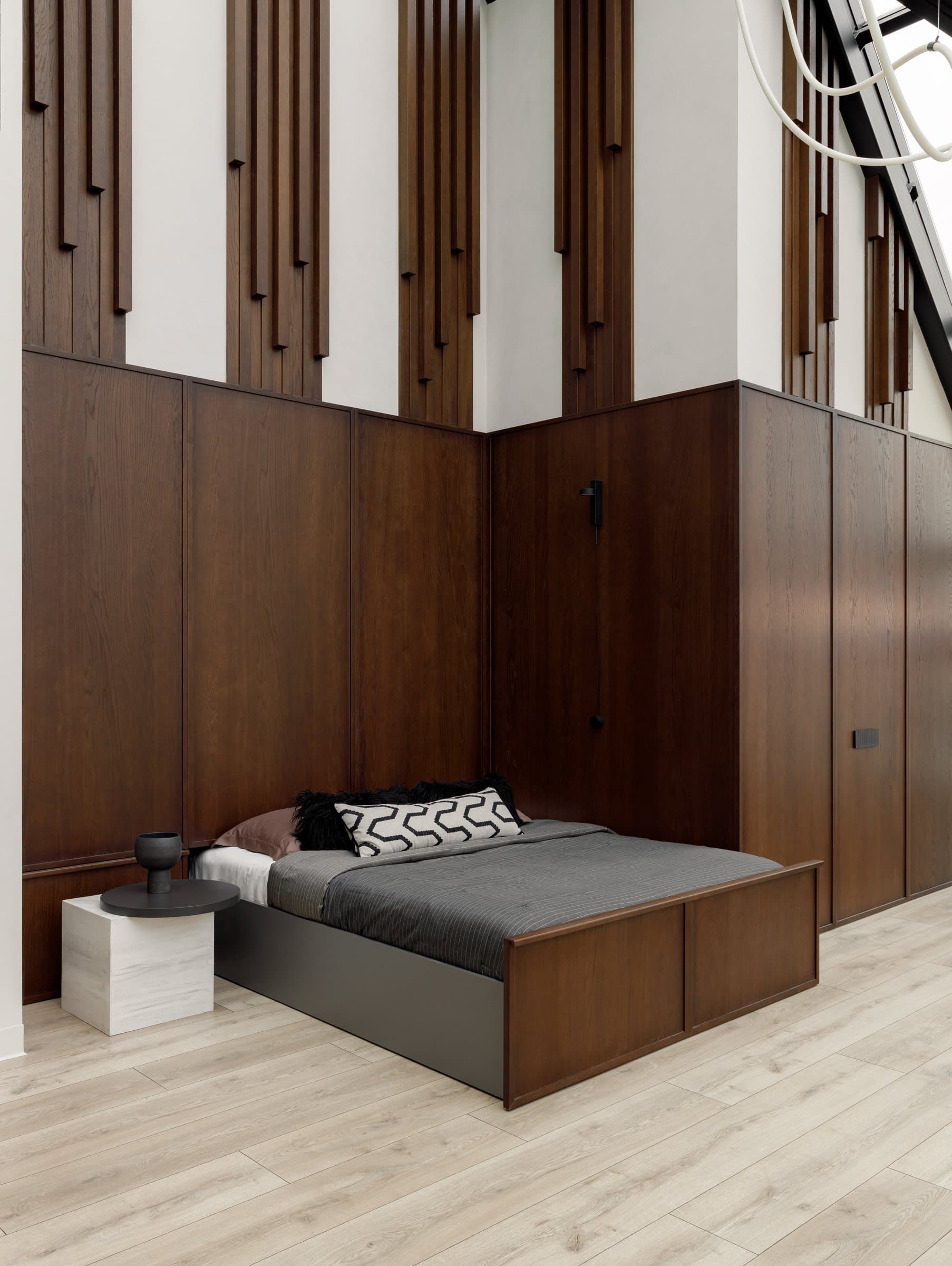 The second-floor sleeping alcove, with a fold-out bed routed within a wall of dark oak panelling