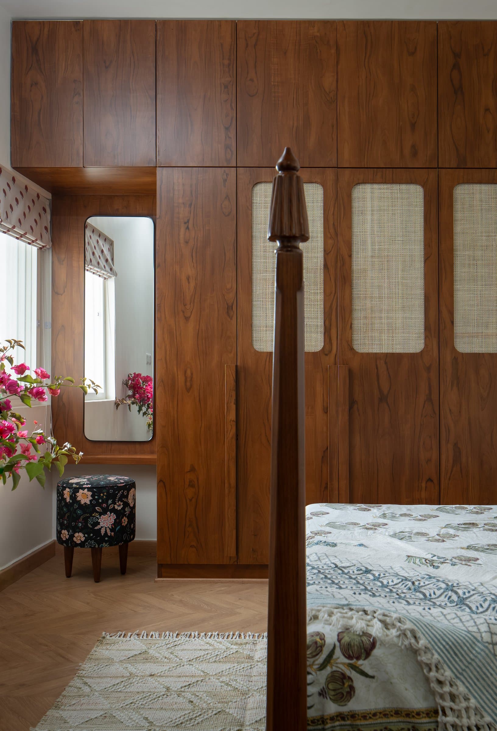 The dressing area folded into the master bedroom, integrating mirror, stool and joinery in a single composition