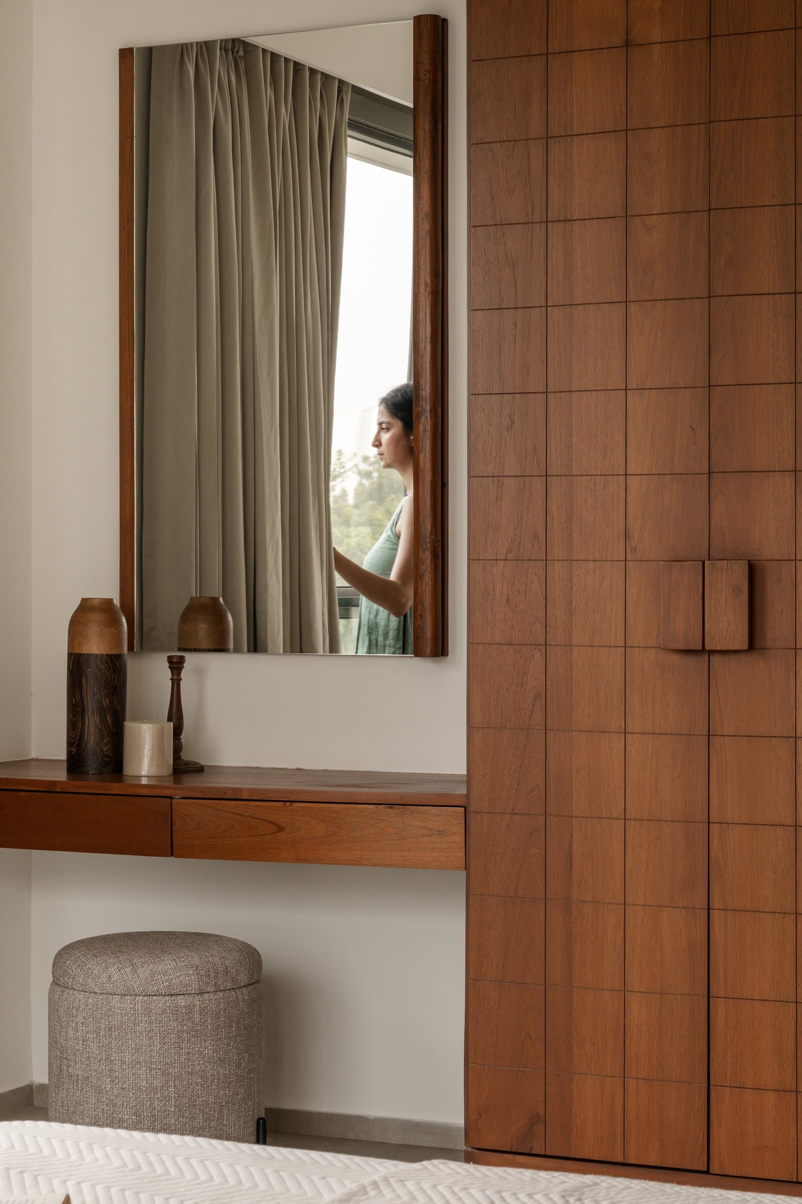 The dressing counter, a slender wooden ledge treating daily ritual as its own composed surface