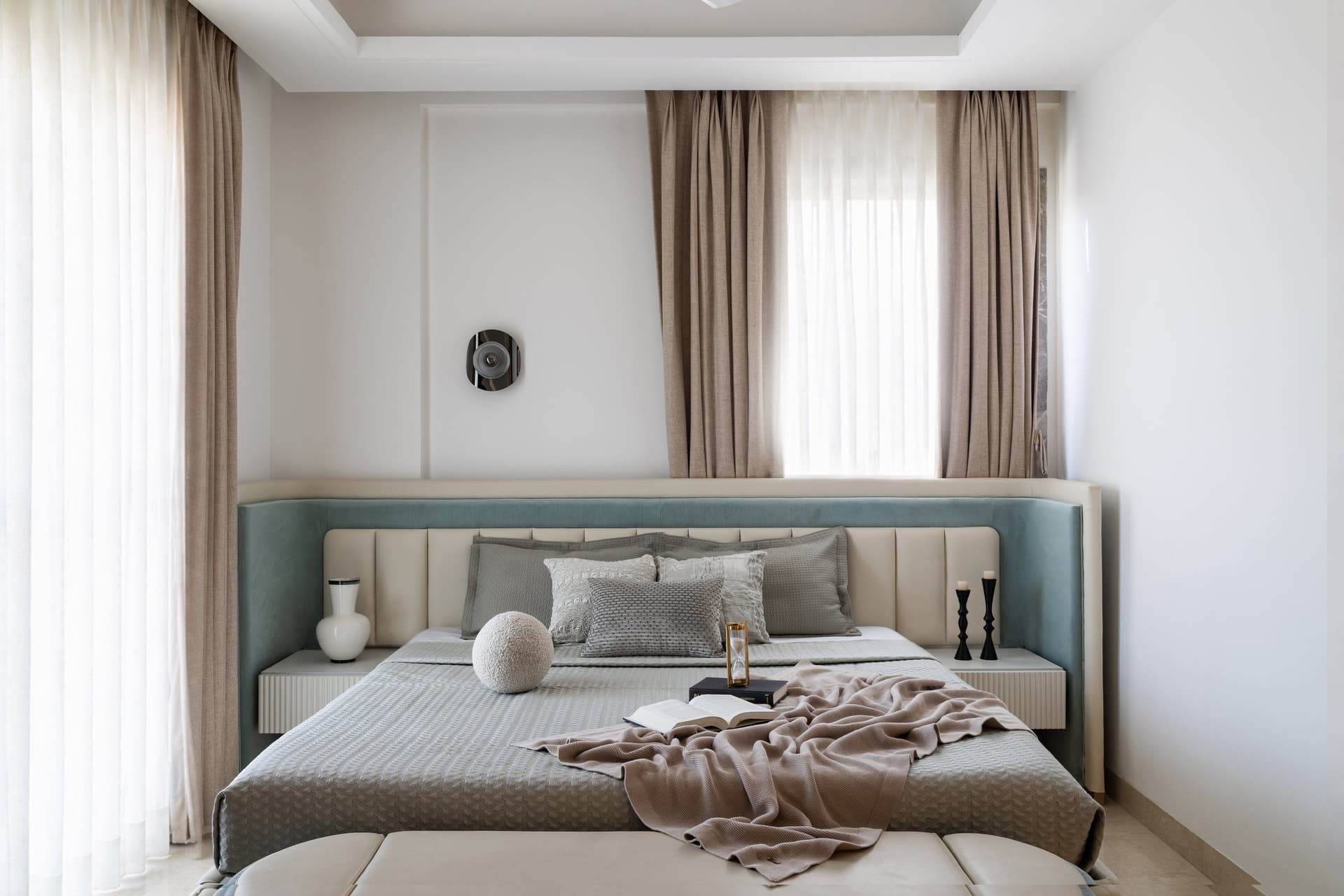 The son's bedroom, wrapped in a channelled headboard wall that extends across the full width