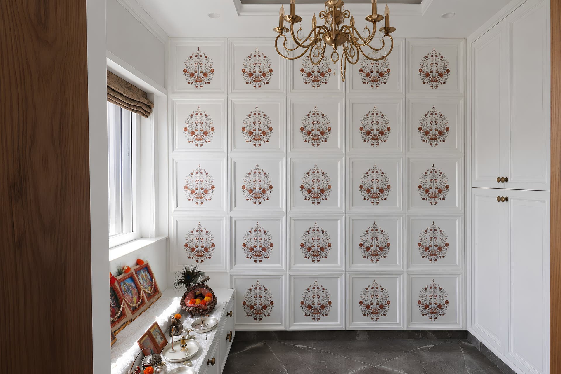 The puja room, where a grid of panels carries delicate floral motifs in coral and sage