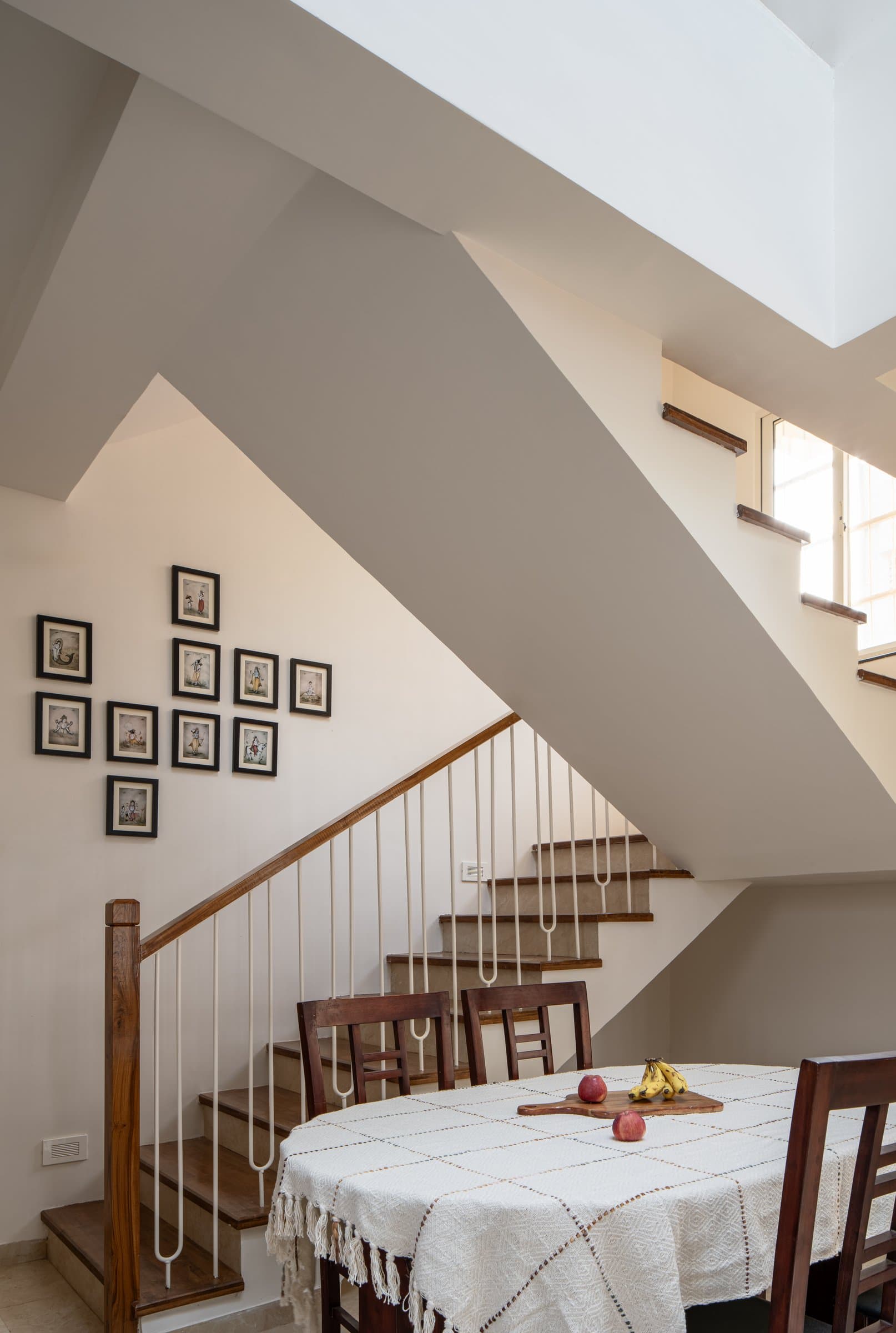 The staircase wall carries the Dashavatar series, ten small framed paintings hung in a loose grid