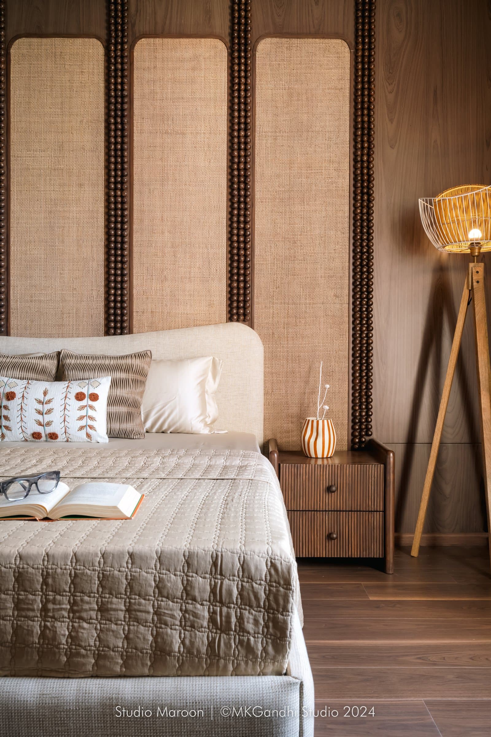The second bedroom: cane panels and turned wooden beading reference handcrafted furniture traditions