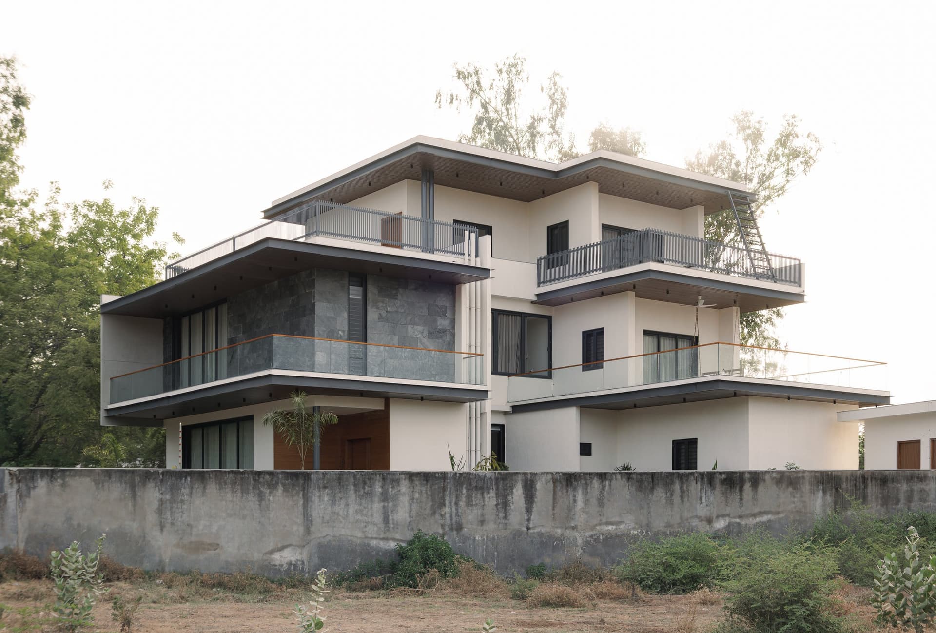 The rear elevation, where the stepped massing pulls back as it rises and each terrace cantilevers over the one below