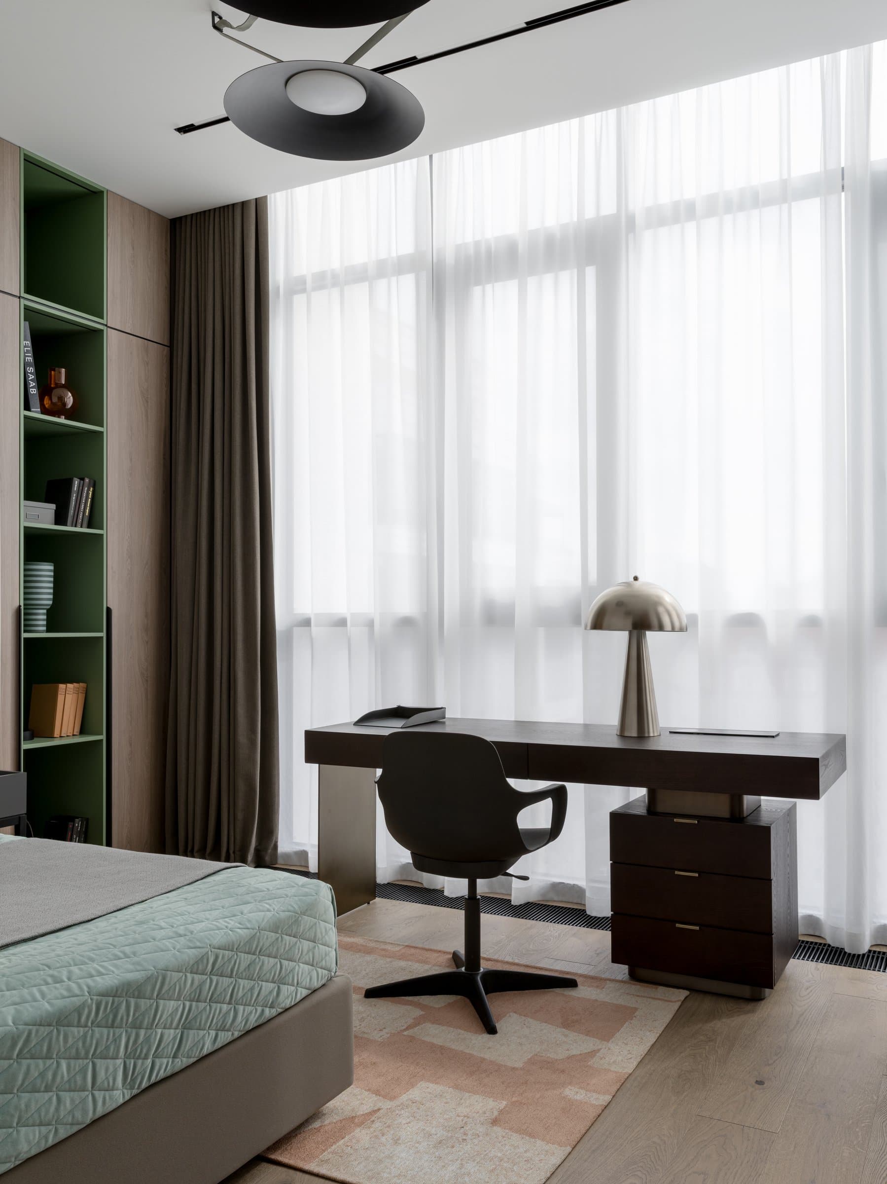 The wider view of the children's room, generously scaled and softly lit by sheer drapery
