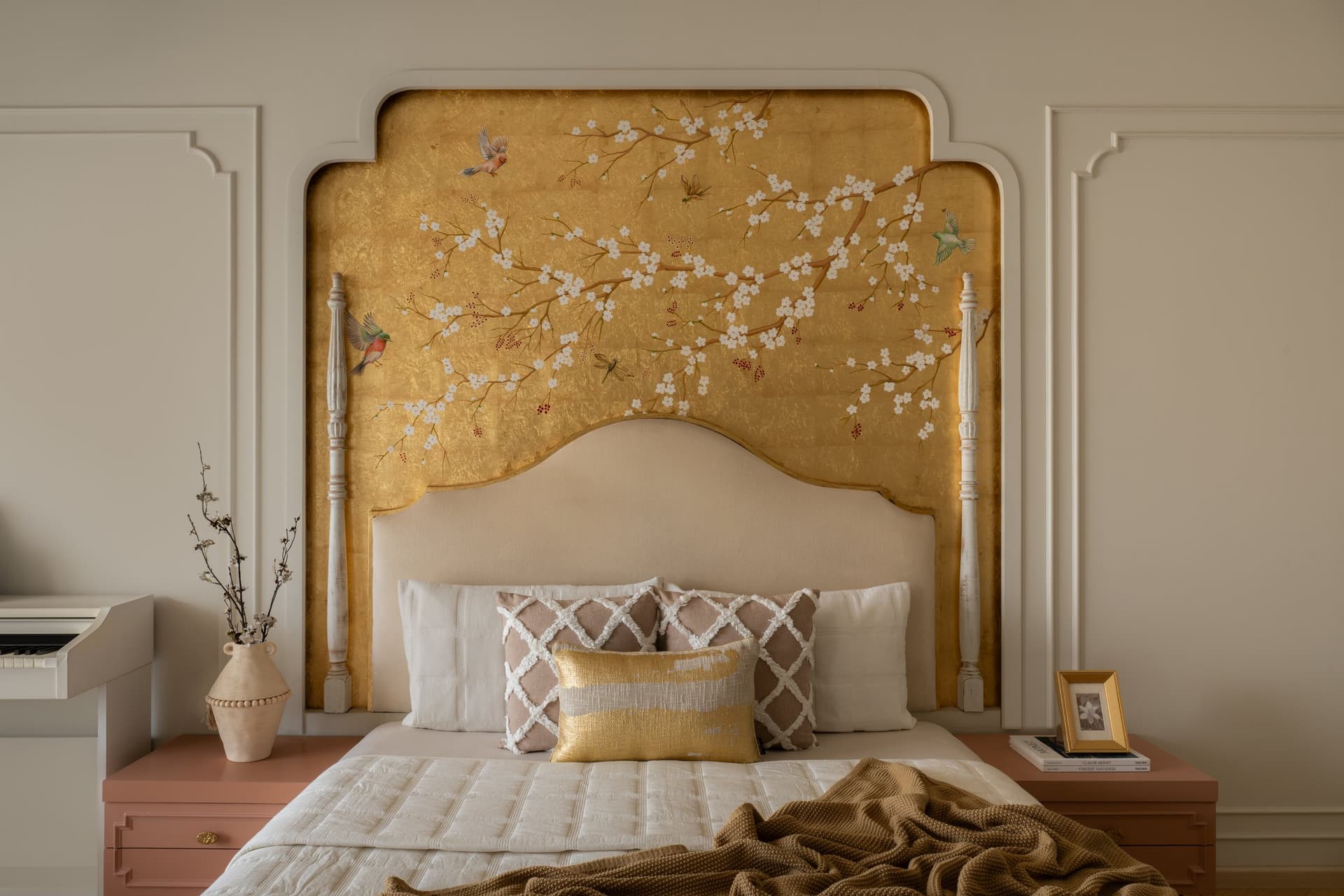 The hand-painted chinoiserie mural on a gold-leaf ground, executed in-house by Mahek Aga Design Studio
