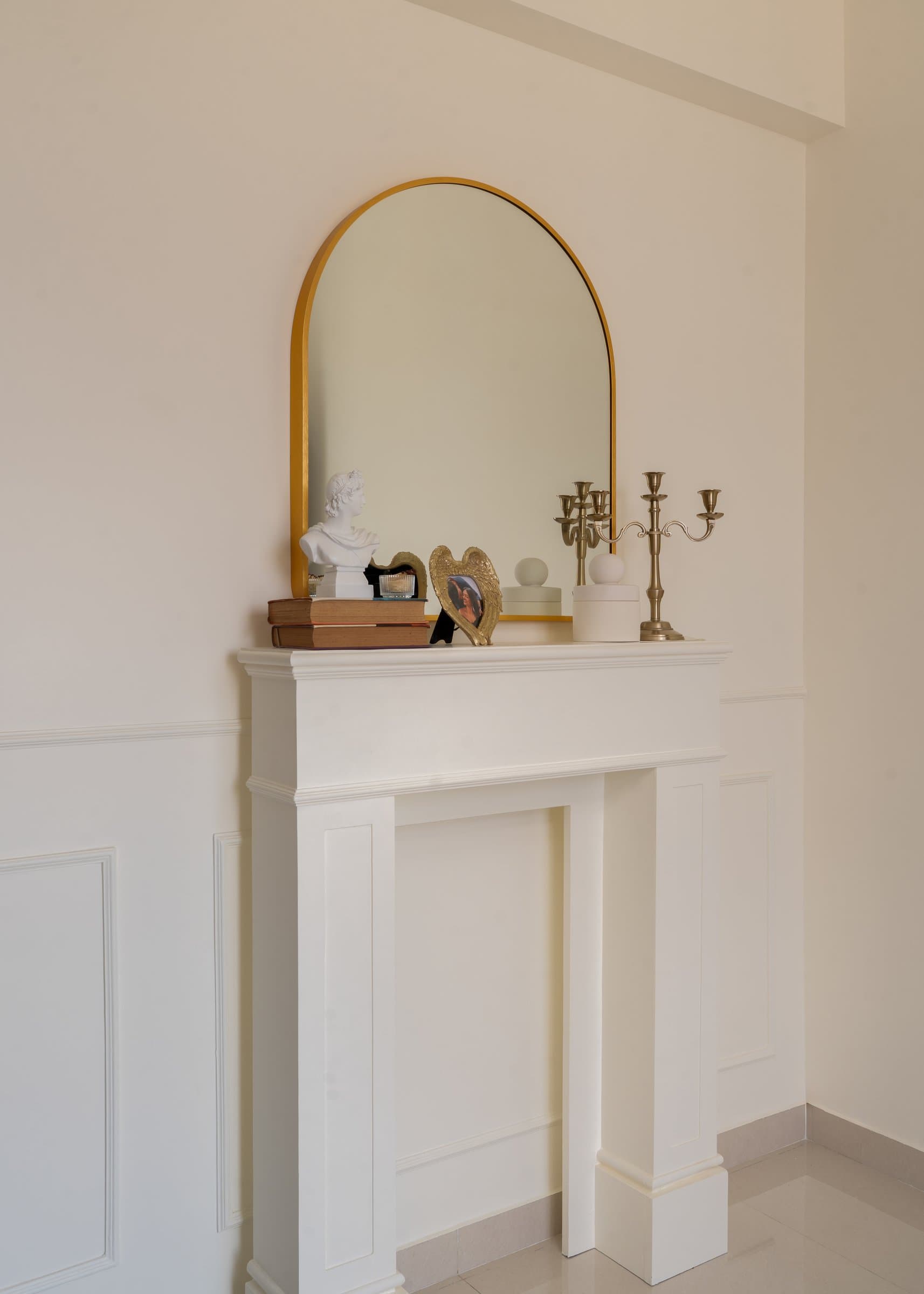 The decorative mantel, an ornamental gesture that anchors the home's European reference