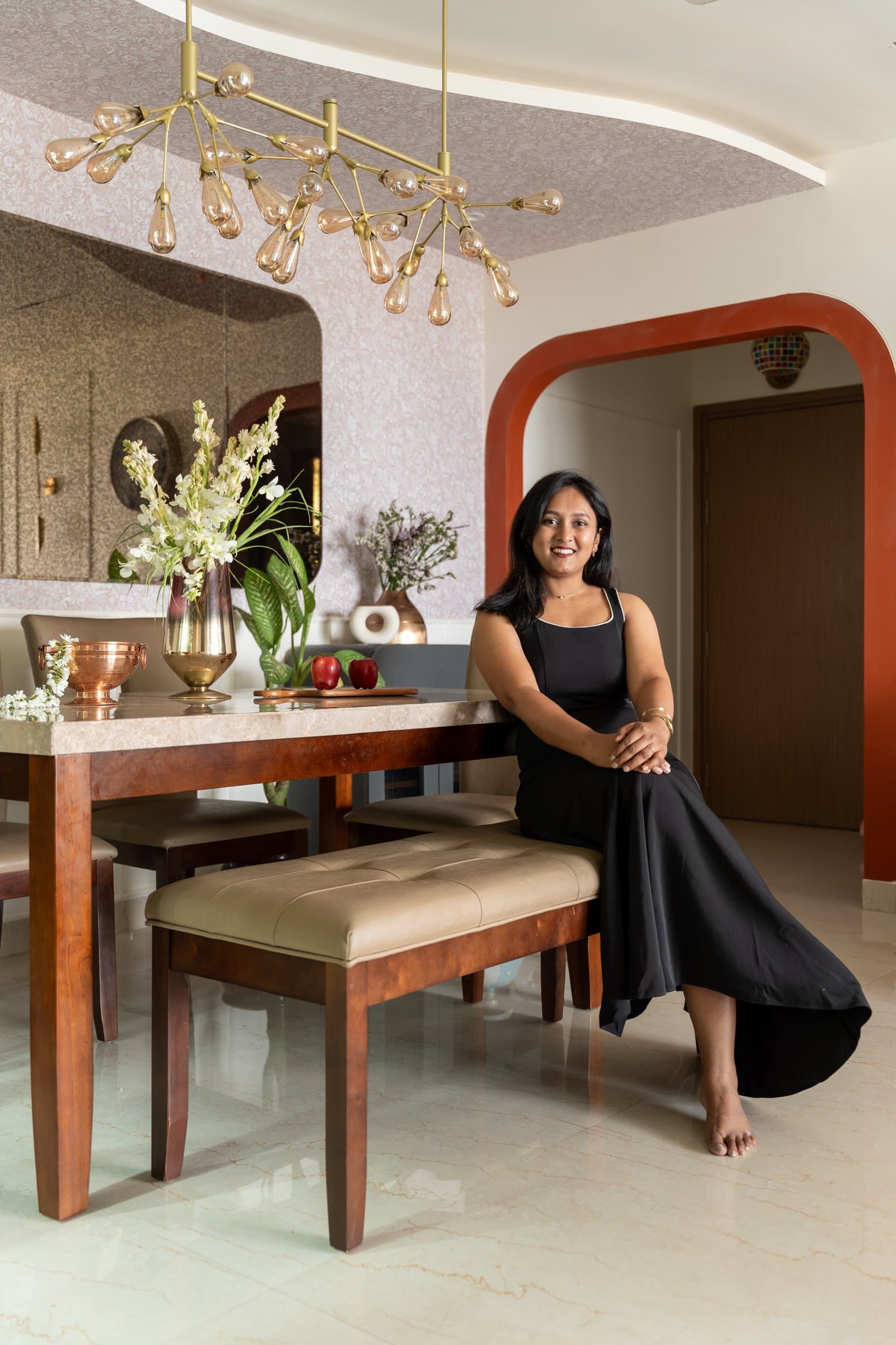 Bhakti Kuber, principal designer of Bhakti Kuber Architects and Interiors, in the dining area of Sanchit