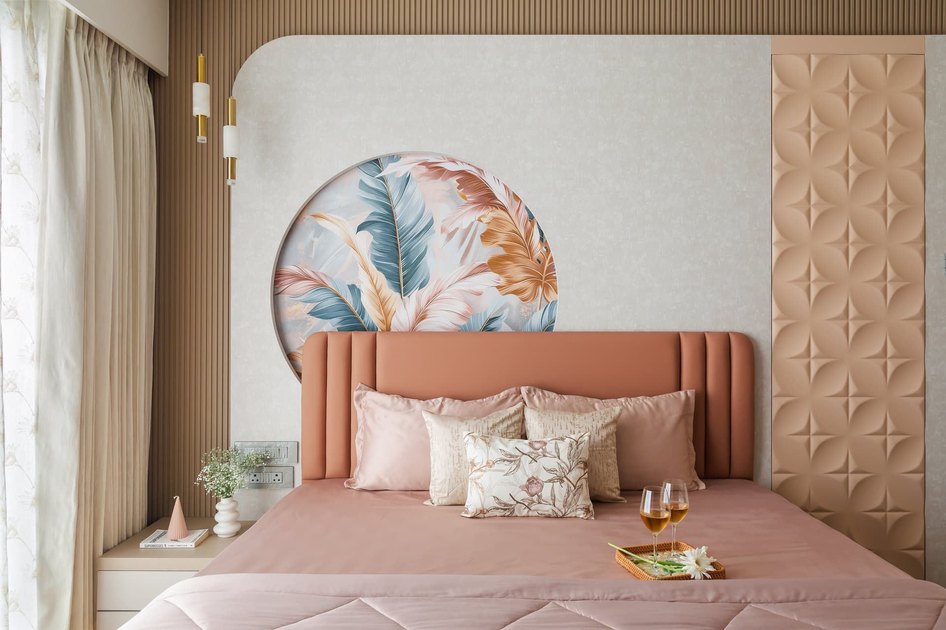 The master bedroom, where a channelled pink headboard and ribbed wooden wall anchor a composition of quiet warmth