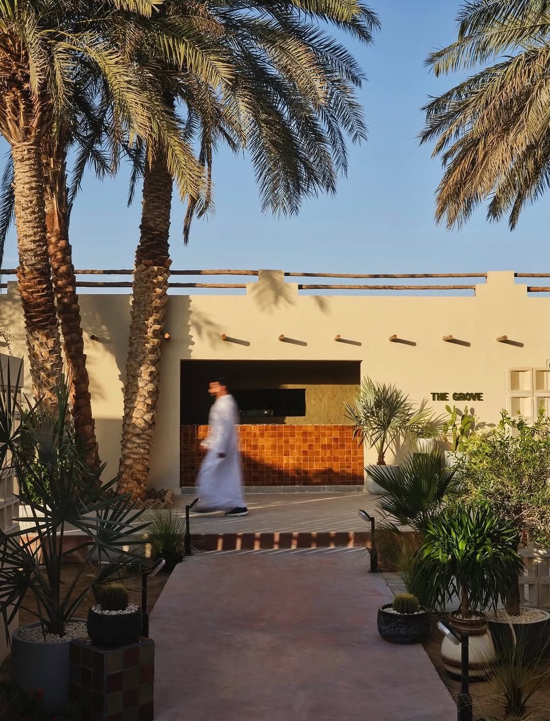 Designed by @studio5.ae , The Grove Café sits quietly within the date palm groves near Al Ain, where the language of tra…